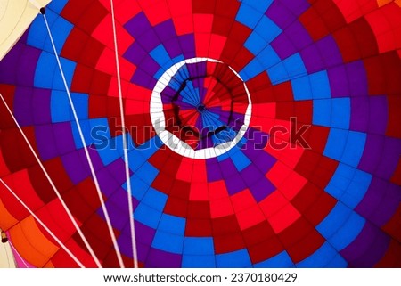 Abstract Background, View Inside Bright Colorful Hot Air Balloon Dome. Multi Colored, Horizontal Plane. Hot Air Expedition, Ride. Joyful, Spectacular Entertainment. High quality photo Royalty-Free Stock Photo #2370180429