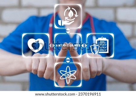 Doctor using virtual touch screen presses text: ANTIOXIDANTS. Natural Antioxidant Nutrition Healthy Eating Diet Medical Concept. Healthy foods rich in antioxidants. Royalty-Free Stock Photo #2370196911