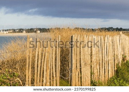 Background seascape behind a wooden fence