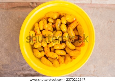 Picture of Olluco in a yellow bucket in Peru, South America. Concept of food and traditions in Peru.