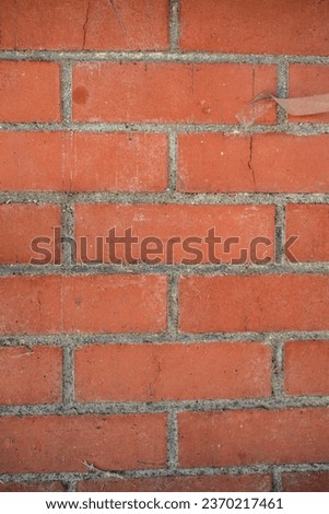 weathered and distressed red brick wall texture