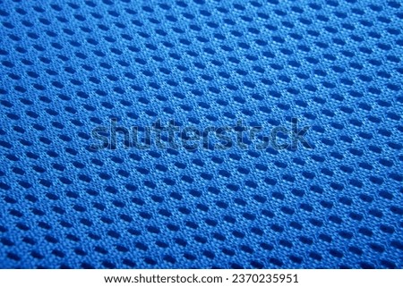 Rough blue fabric texture, cotton knitted fabric, modern waterproof flexible temperature control materials, multifunctional smart textile close-up, selective focus, does not tear