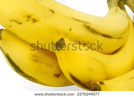 This picture emphasizes the visual appeal of a bunch of bananas, highlighting their perfect shape and yellow color. It also suggests the idea that bananas are a beautiful, nutritious food.