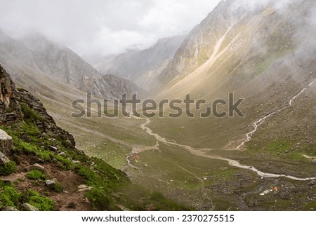 View enroute to Hampta pass hiking trail near 'shea goru' camp site in lahaul spiti near Manali, Himachal Pradesh, India. Royalty-Free Stock Photo #2370275515