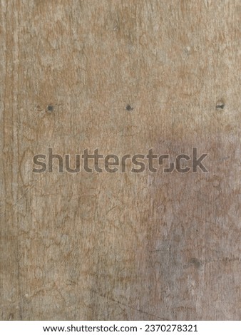 The time-worn texture of plywood produces amazing patterns. Royalty-Free Stock Photo #2370278321