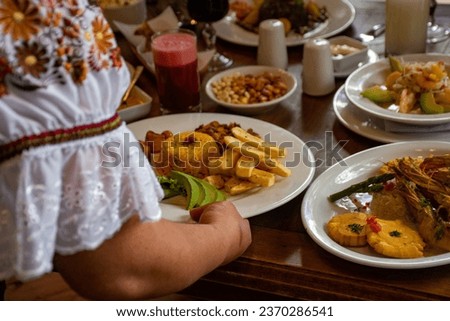 Traditional ecuadorian food served on a table.  Royalty-Free Stock Photo #2370286541