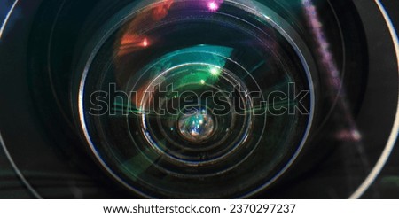 Camera Lens Flare, 
Lens Reflection Photography, 
Optical Lens Effects, 
Sunlight Glare in Lens, 
Light Flare on Camera Glass Royalty-Free Stock Photo #2370297237