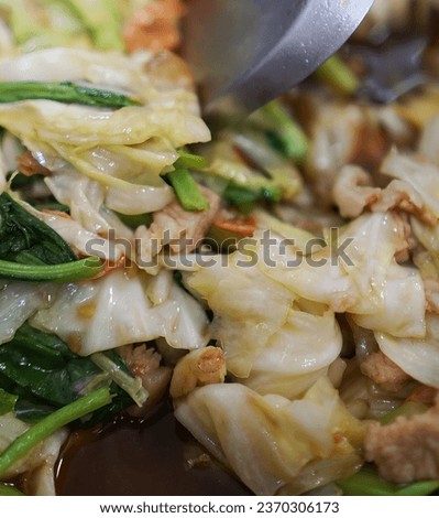 a close up of a plate of food with a knife.