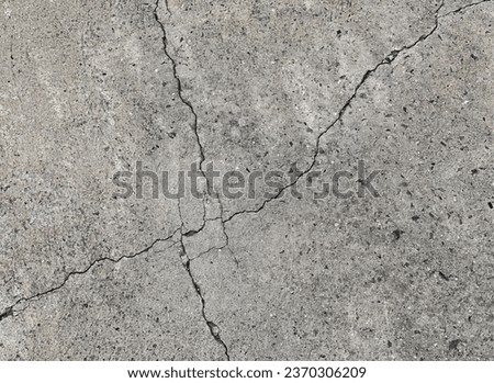 a cracked concrete floor with a crack.
