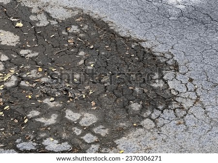 the pothole in the road.
