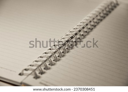 open blank book with spiral ring binding Royalty-Free Stock Photo #2370308451