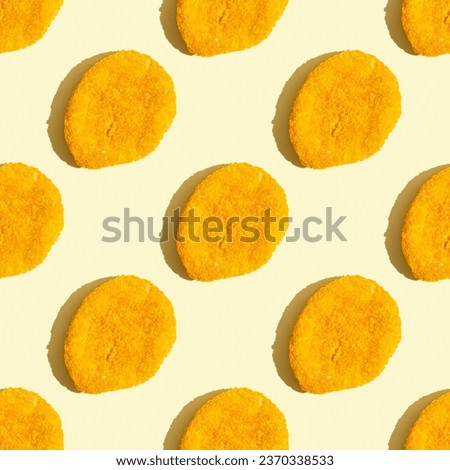 Seamless pattern with chicken nugget on yellow background.