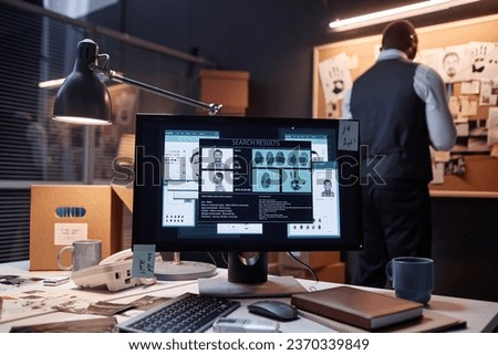 Background image of computer with case file on screen in detectives office, copy space Royalty-Free Stock Photo #2370339849