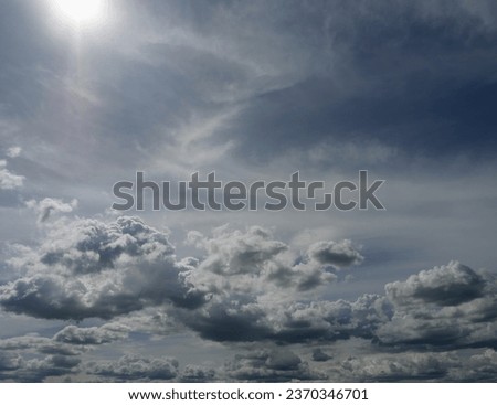 Cumulus cloud on beautiful blue sky in day light , Sun with sunny and fluffy clouds formations at tropical zone
