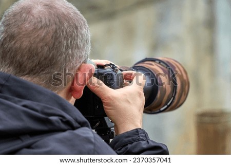Male photographer taking a picture                           