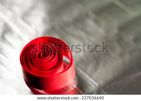 Macro, abstract, background picture of red paper spirals with reflexions