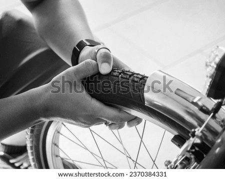 at the bike shop store and repair , artisan expert mechanic expert repairs restore bicycle tires