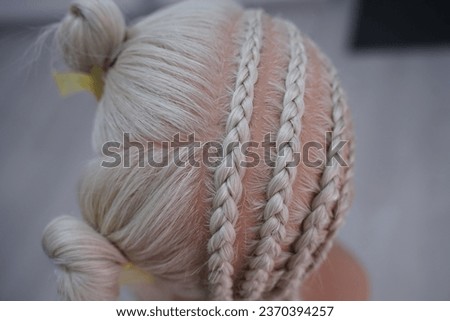 marking a mannequin's head into zones, hairdressing, teaching students, hair cutting, braiding. The master demonstrates to his students the division of the head into zones Royalty-Free Stock Photo #2370394257