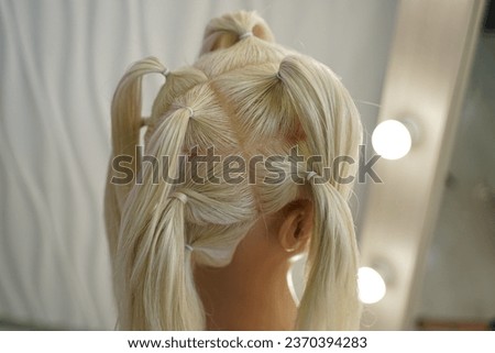 marking a mannequin's head into zones, hairdressing, teaching students, hair cutting, braiding. The master demonstrates to his students the division of the head into zones Royalty-Free Stock Photo #2370394283
