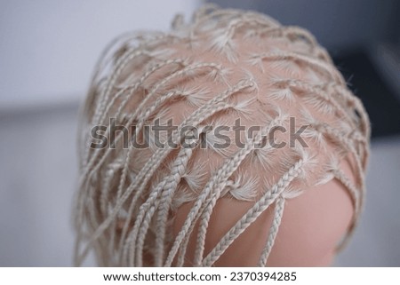 marking a mannequin's head into zones, hairdressing, teaching students, hair cutting, braiding. The master demonstrates to his students the division of the head into zones Royalty-Free Stock Photo #2370394285