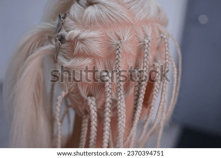marking a mannequin's head into zones, hairdressing, teaching students, hair cutting, braiding. The master demonstrates to his students the division of the head into zones Royalty-Free Stock Photo #2370394751