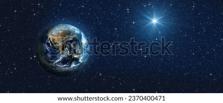 Bright star of Jesus and planet Earth on the starry sky. Bethlehem Star of the Nativity of Jesus Christ. Elements of this image furnished by NASA