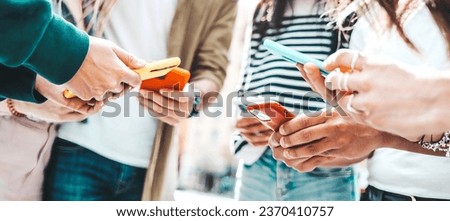 Group of young people using smart mobile phone device outside - Teenagers addicted to social media - Technology life style concept Royalty-Free Stock Photo #2370410757