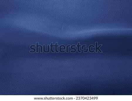Rough navy blue fabric texture, cotton knitted fabric, modern waterproof flexible temperature control materials, multifunctional smart textile close-up, selective focus, does not tear.