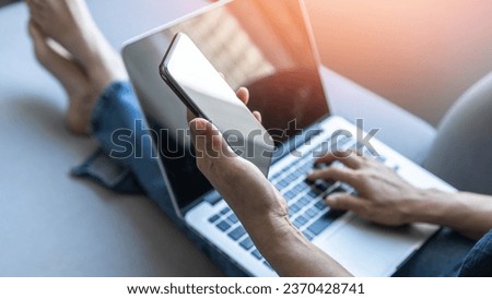 Digital lifestyle blog writer or business person work at home using smart device working on mobile smartphone and computer laptop via internet communication network technology and e-commerce marketing