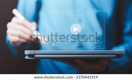 man searching for information to watch various videos ,streaming onlinewatching video on internet, live concert, show or tutorial,webinars online business training 