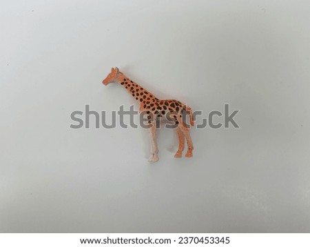 Closeup of various Zoo Wild Animal Figures Toys for Kids isolated on white background.