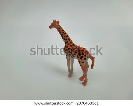 Closeup of various Zoo Wild Animal Figures Toys for Kids isolated on white background.