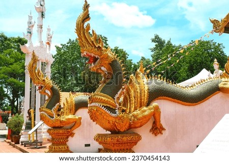Samut Sakhon, Krathum Baen, Thailand. - Naga statue in front of Wat Tha Mai. 