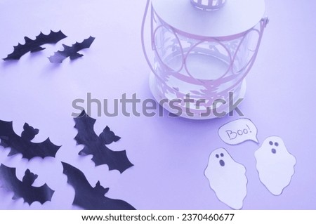 funny halloween background - ghosts next to lantern in the blue background 