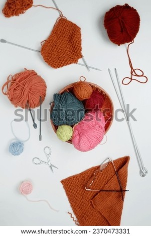 Color yarn for knitting, white background. Knitting project in progress. Top view,  flat lay