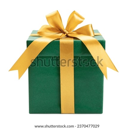 green gift box wrapped with gold bow and ribbon isolated on white background. Royalty-Free Stock Photo #2370477029