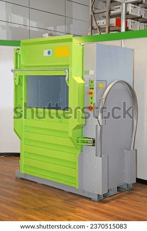 Hydraulic Press Machine Compacting Waste Material for Recycling Environment Royalty-Free Stock Photo #2370515083