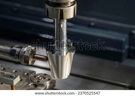 The sinker EDM machine operation. The mold and die manufacturing concept by 4-axis EDM machine. Royalty-Free Stock Photo #2370525547