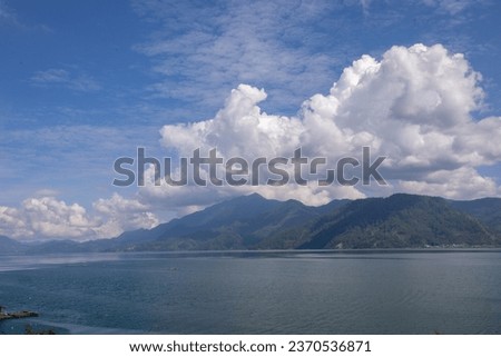 Beautiful nature. mountains. Island and blue sea. Blue cloud sky