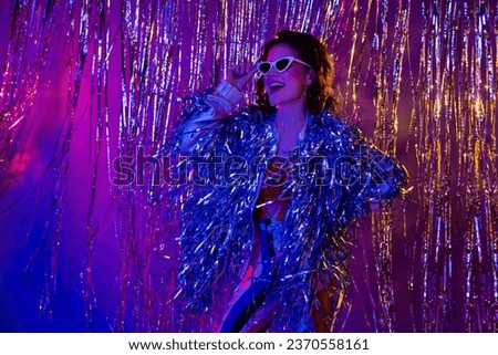 Photo of excited overjoyed pretty girl chilling clubbing rio carnival hand touch sunglass isolated on multicolor backdrop background