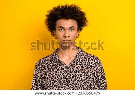 Portrait of youngster guy chevelure leopard stylish print shirt confident tourist passport picture isolated on yellow color background