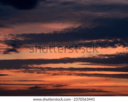End of the day concept. Beautiful clouds after sunset. Sunset Sky on Twilight in the Evening with Orange Gold Sunset Cloud. Royalty-Free Stock Photo #2370563441