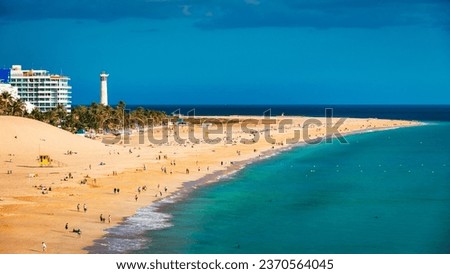 Morro Jable, Fuerteventura, Spain. Breathtaking beach Playa del Matorral in the rays of the sunset. Morro Jable and Playa del Matorral, Fuerteventura, Canary Islands, Spain, Atlantic, Europe Royalty-Free Stock Photo #2370564045