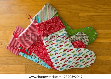 Stack of handmade Christmas stockings.