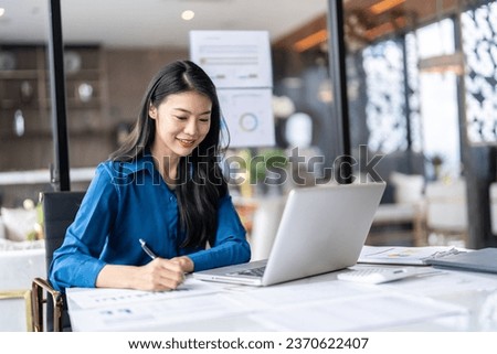 Beautiful Business Woman working by using laptop computer Hands typing on keyboard. Professional investor working new start up project. business planning in office. Technology business Concept