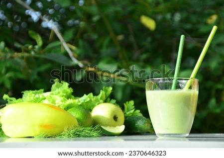 Food and drink, healthy dieting and nutrition, lifestyle, vegan, alkaline, vegetarian concept. Green smoothie with organic ingredients, vegetables on a modern kitchen table Royalty-Free Stock Photo #2370646323