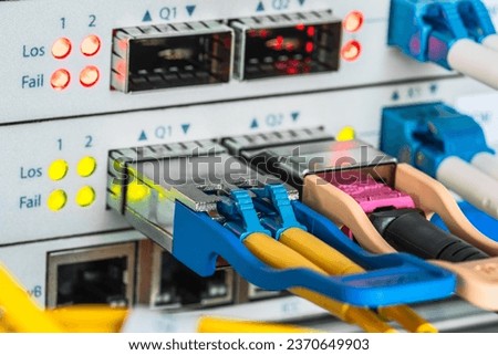 Network optical fiber cables and data transmission network equipment Royalty-Free Stock Photo #2370649903