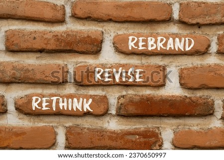 Rethink revise rebrand symbol. Concept word Rethink Revise Rebrand on beautiful bricks. Beautiful red brown brickwall background. Business brand motivational rethink revise rebrand concept. Copy space