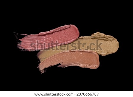 Cosmetic lipstick or blusher swatch set isolated on black