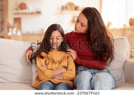 Kid Mental Problem. Loving Mom Talking And Embracing Unhappy Daughter, Supporting Child In Preteen Struggles And Depression, Sitting Together On Couch In Living Room At Home Royalty-Free Stock Photo #2370679163